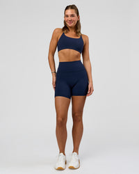 Woman wearing O.G. Fusion Ultra High-Rise 6" Short Pockets - Future Navy | Model:Amity | Size:S | Thumbnail Index: 5