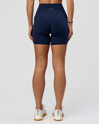 Woman wearing O.G. Fusion Ultra High-Rise 6" Short Pockets - Future Navy | Model:Amity | Size:S | Thumbnail Index: 8