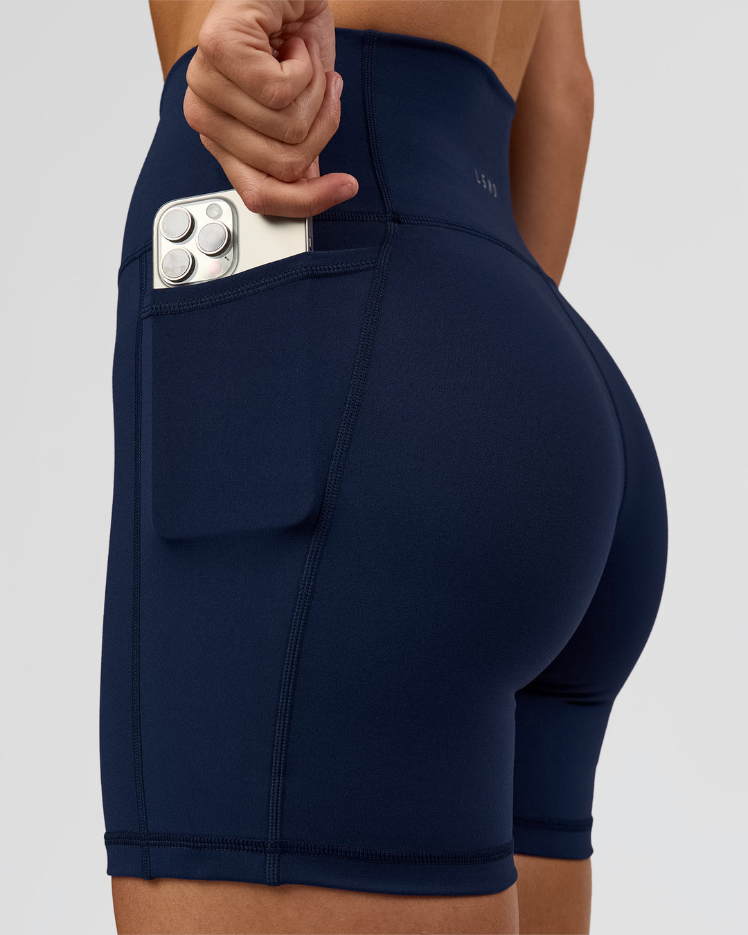 Woman wearing O.G. Fusion Ultra High-Rise 6" Short Pockets - Future Navy | Model:Amity | Size:S - view 4