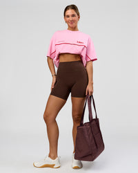 Woman wearing O.G. Fusion Ultra High-Rise 6" Short Pockets - Hot Chocolate | Model:Amity | Size:S | Thumbnail Index: 2
