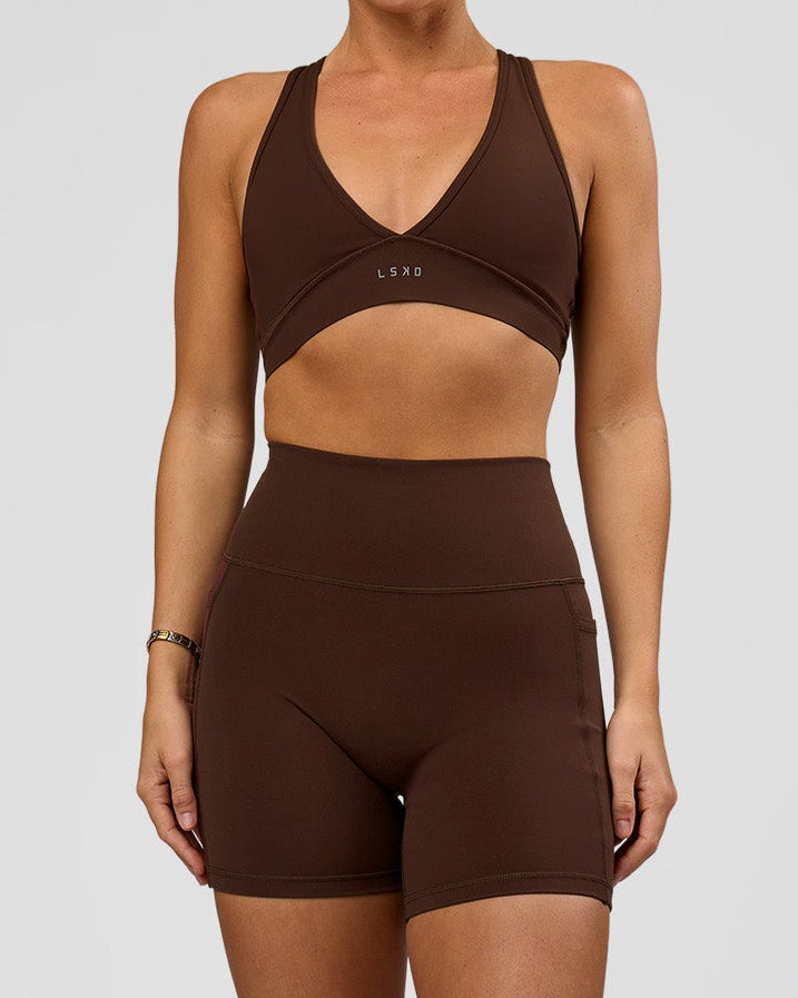 Woman wearing O.G. Fusion Ultra High-Rise 6" Short Pockets - Hot Chocolate | Model:Amity | Size:S