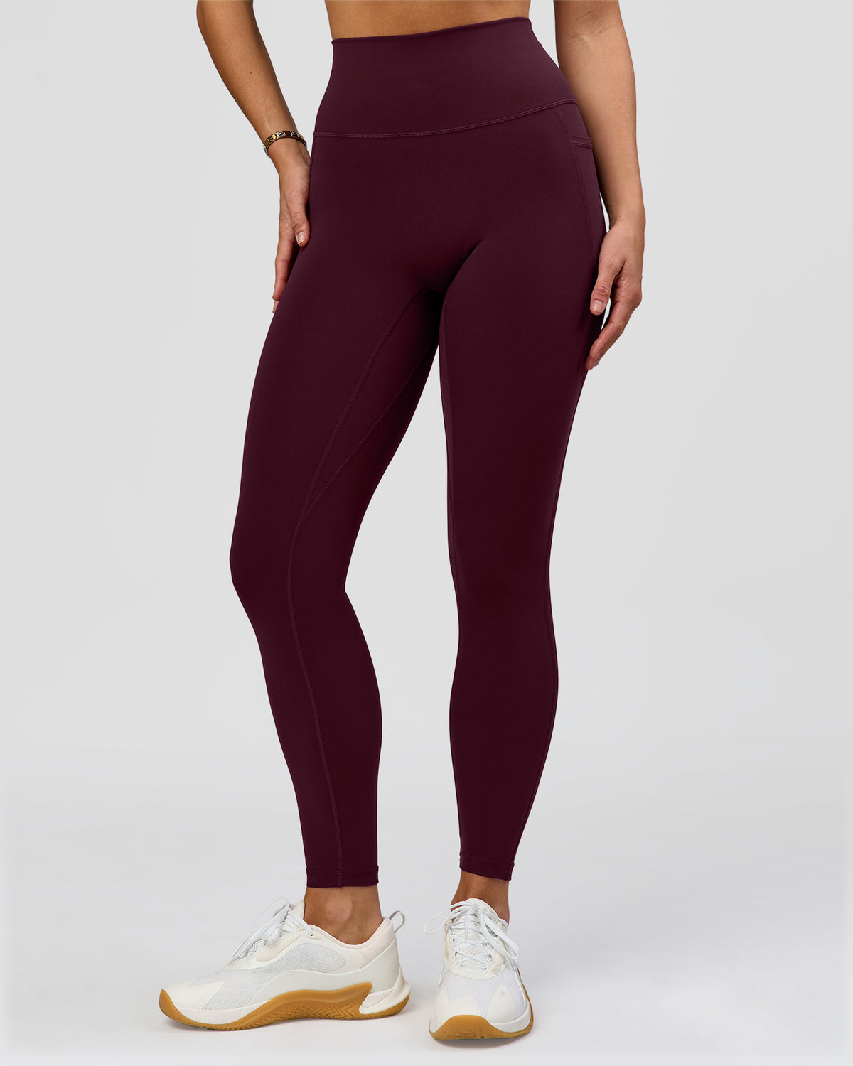 Woman wearing O.G. Fusion Ultra High-Rise Full Length Legging Pockets - Cherry Lacquer | Model:Amity | Size:S