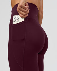 Woman wearing O.G. Fusion Ultra High-Rise Full Length Legging Pockets - Cherry Lacquer | Model:Amity | Size:S | Thumbnail Index: 6