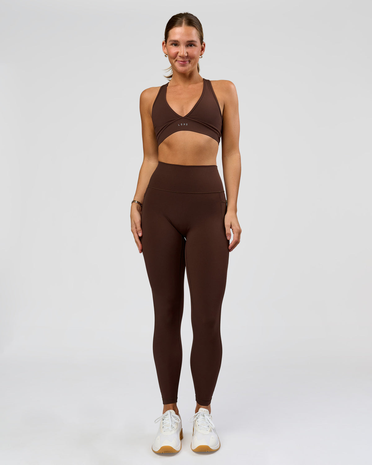 Woman wearing O.G. Fusion Ultra High-Rise Full Length Legging Pockets - Hot Chocolate | Model:Amity | Size:S
