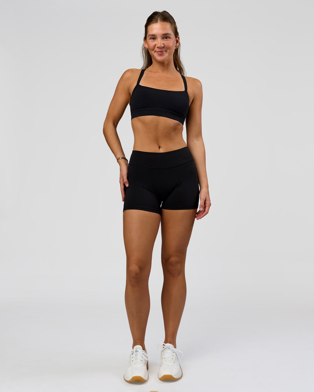 Woman wearing RXD Mid-Rise 4" Short - Black | Model:Amity | Size:S - view 5
