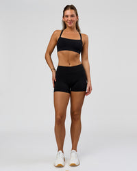 Woman wearing RXD Mid-Rise 4" Short - Black | Model:Amity | Size:S | Thumbnail Index: 4