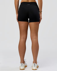 Woman wearing RXD Mid-Rise 4" Short - Black | Model:Amity | Size:S | Thumbnail Index: 6