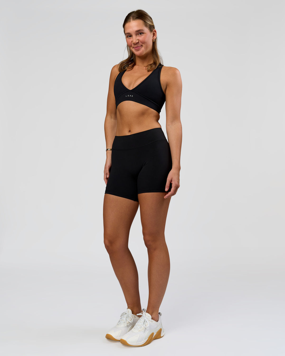 Woman wearing RXD Mid-Rise 6" Short - Black | Model:Amity | Size:S - view 4