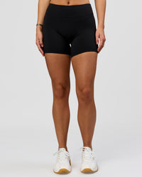 Woman wearing RXD Mid-Rise 6" Short - Black | Model:Amity | Size:S | Thumbnail Index: 4