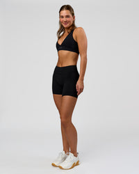 Woman wearing RXD Mid-Rise 6" Short - Black | Model:Amity | Size:S | Thumbnail Index: 7
