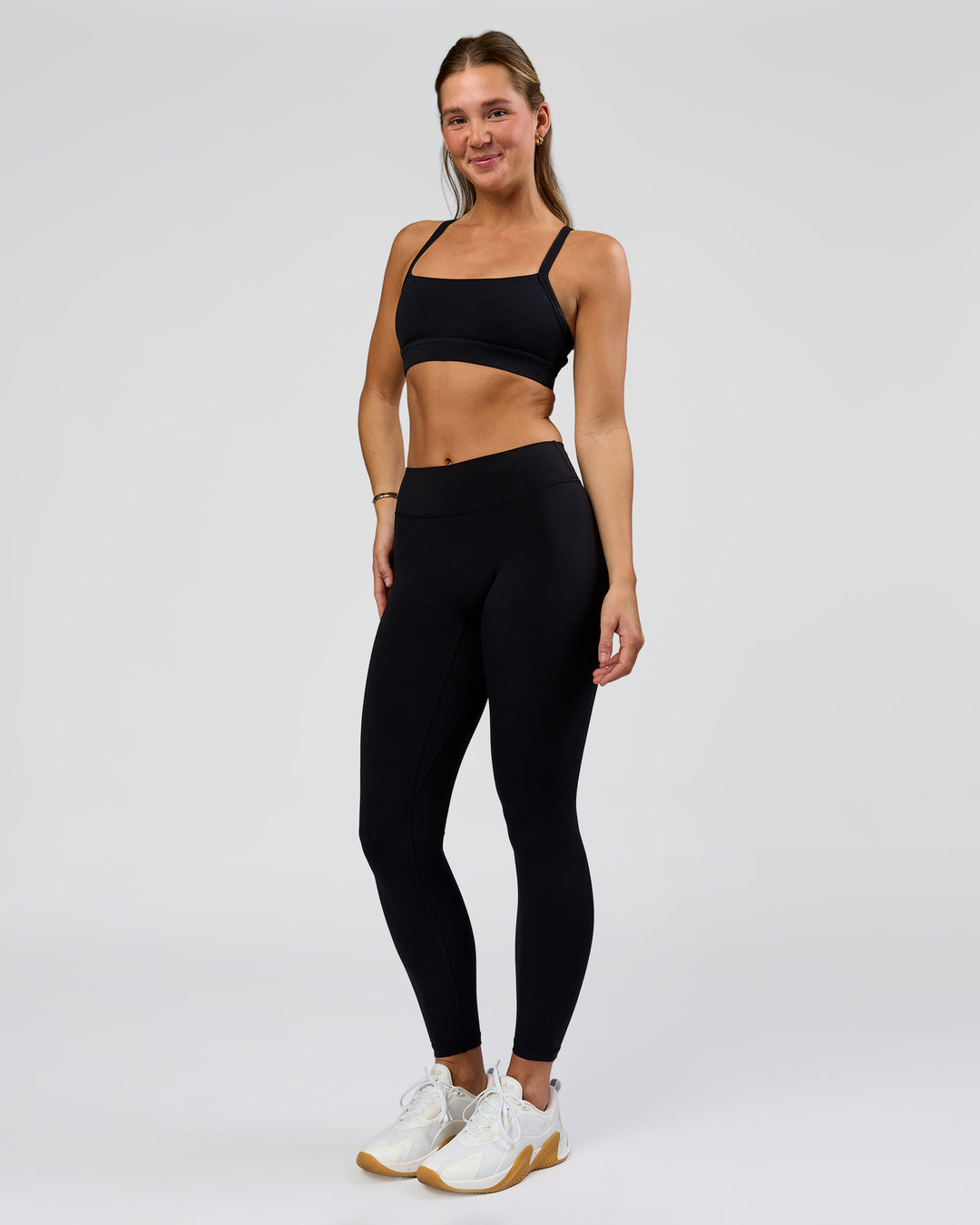 Woman wearing RXD Mid-Rise Full Length Legging - Black | Model:Amity | Size:S - view 3