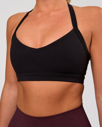 Woman wearing Unleash Sports Bra - Black | Model:Amity | Size:S | Thumbnail Index: 0
