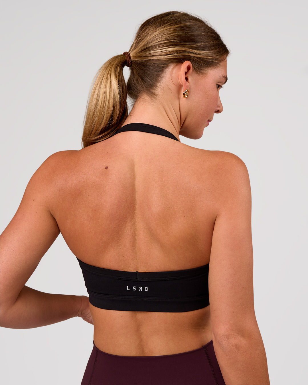 Woman wearing Unleash Sports Bra - Black | Model:Amity | Size:S - view 2