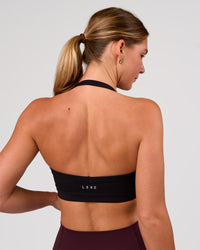 Woman wearing Unleash Sports Bra - Black | Model:Amity | Size:S | Thumbnail Index: 1