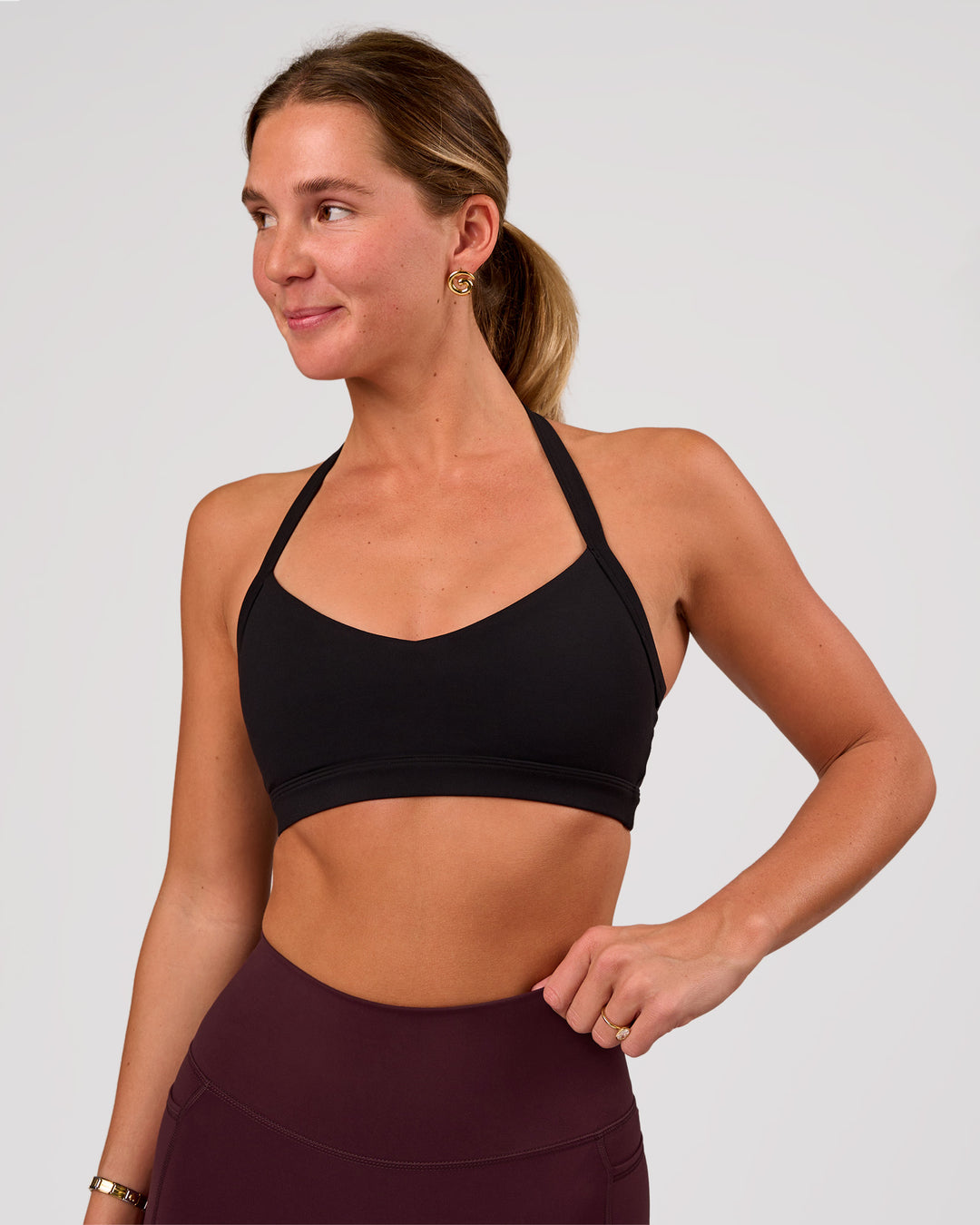 Woman wearing Unleash Sports Bra - Black | Model:Amity | Size:S - view 3