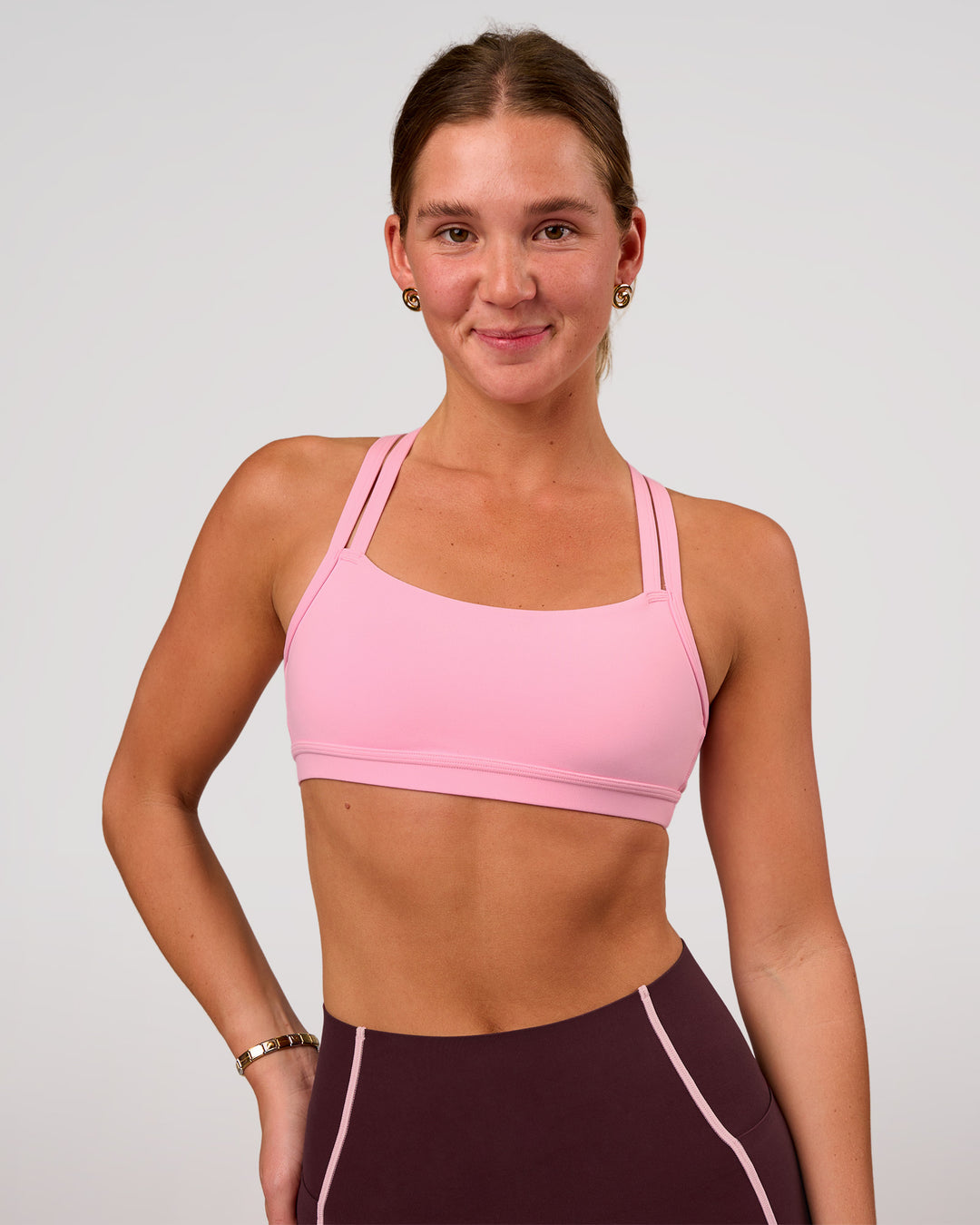 Woman wearing Velocity Sports Bra - Pink Rose | Model:Amity | Size:S - view 3