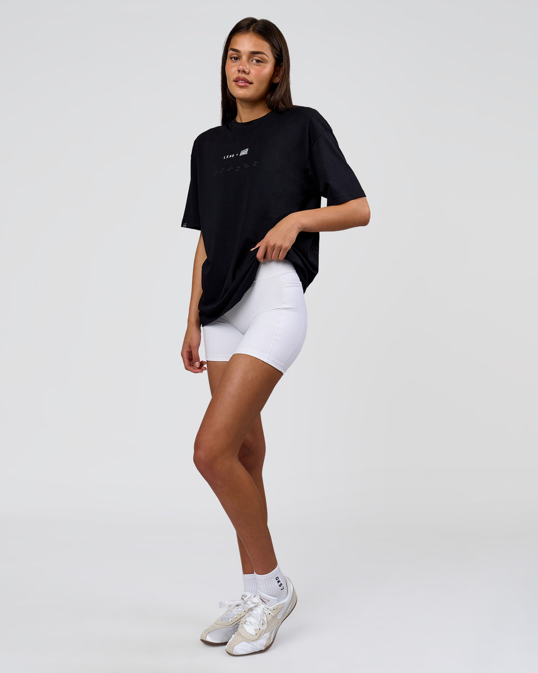 Woman wearing Deadly Runners Run Club FLXCotton Oversize Tee - Black | Model:Bella | Size:S - view 16