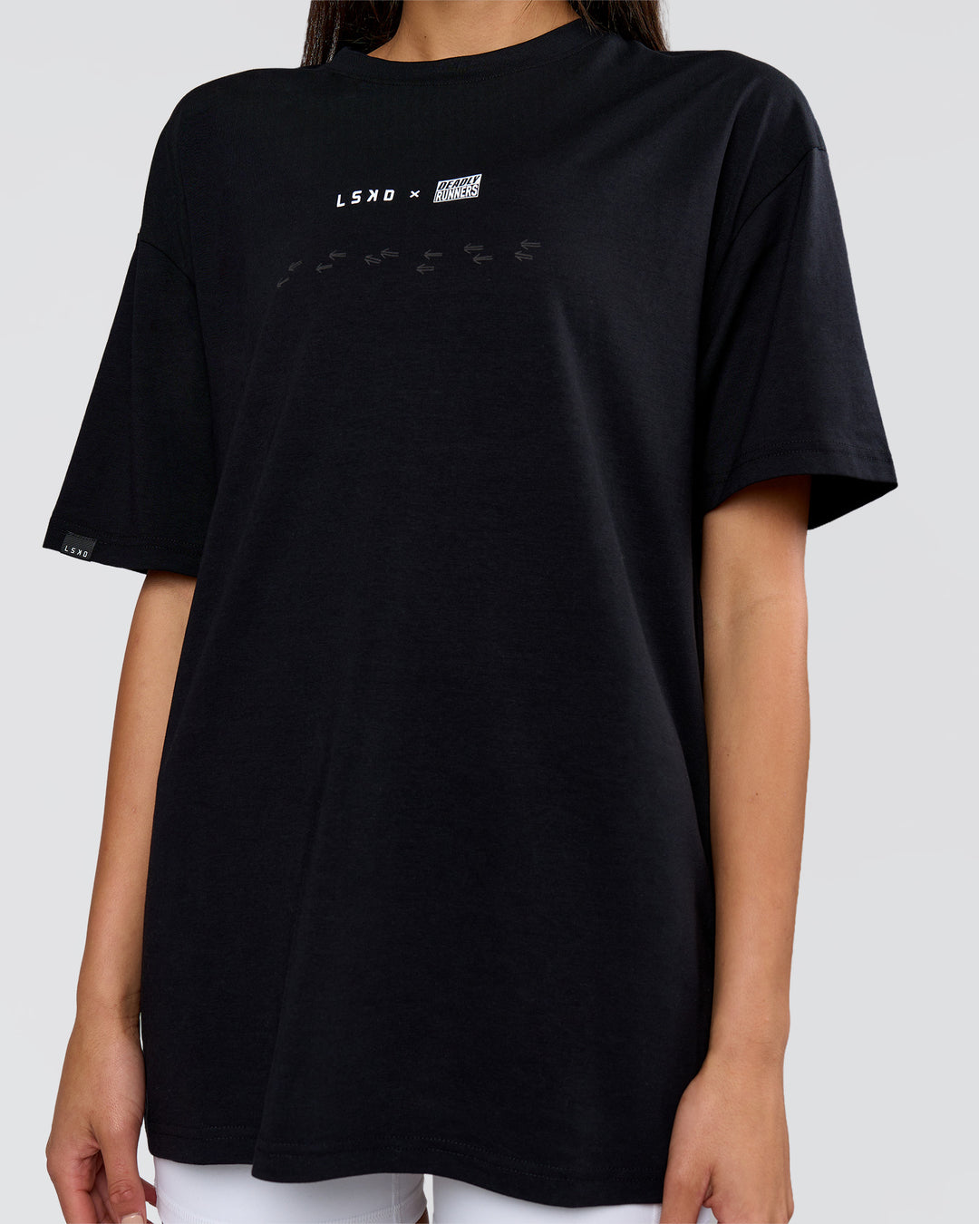 Woman wearing Deadly Runners Run Club FLXCotton Oversize Tee - Black | Model:Bella | Size:S - view 18