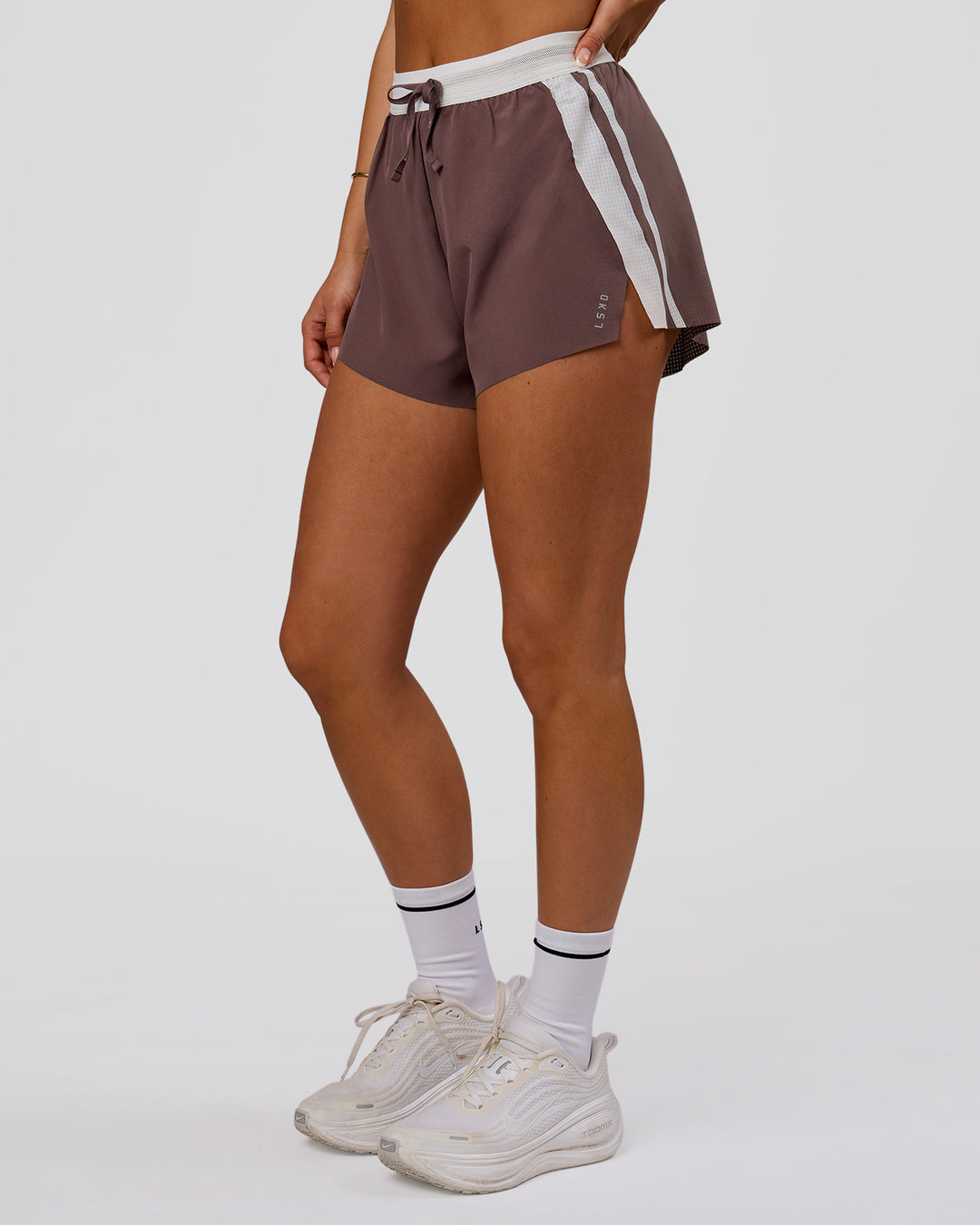 Woman wearing Accelerate 3" Force High-Rise Running Short - Cocoa Powder | Model:Bianca | Size:S - view 2