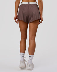 Woman wearing Accelerate 3" Force High-Rise Running Short - Cocoa Powder | Model:Bianca | Size:S | Thumbnail Index: 6
