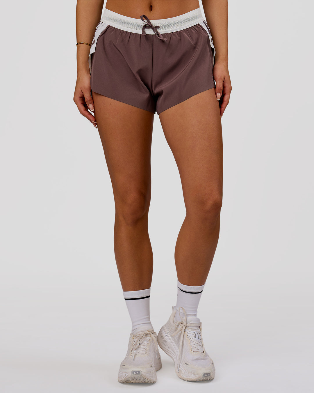Woman wearing Accelerate 3" Force Mid-Rise Running Short - Cocoa Powder | Model:Bianca | Size:S - view 4