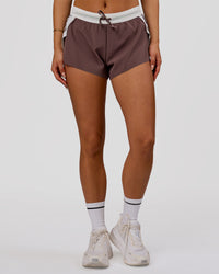 Woman wearing Accelerate 3" Force Mid-Rise Running Short - Cocoa Powder | Model:Bianca | Size:S | Thumbnail Index: 3