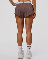Woman wearing Accelerate 3" Force Mid-Rise Running Short - Cocoa Powder | Model:Bianca | Size:S | Thumbnail Index: 7