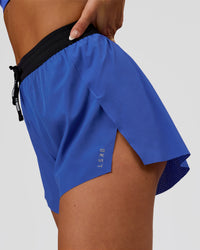Woman wearing Accelerate 3" High-Rise Running Short - Black-Power Cobalt | Model:Bianca | Size:S | Thumbnail Index: 1