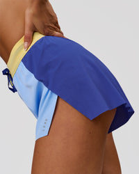 Woman wearing Accelerate 3" High-Rise Running Short - Power Cobalt-Open Air-Lemon | Model:Bianca | Size:S | Thumbnail Index: 5