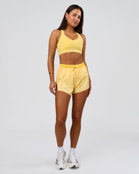 Woman wearing Accelerate 3" High-Rise Running Short - Sunbeam-Lemon | Model:Bianca | Size:S | Thumbnail Index: 8