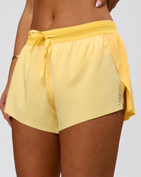 Woman wearing Accelerate 3" Mid-Rise Running Short - Sunbeam-Lemon | Model:Bianca | Size:S | Thumbnail Index: 4