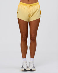 Woman wearing Accelerate 3" Mid-Rise Running Short - Sunbeam-Lemon | Model:Bianca | Size:S | Thumbnail Index: 7