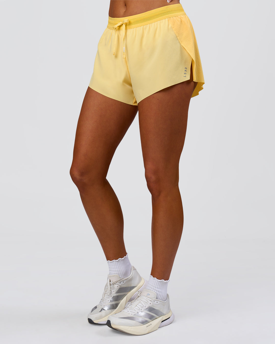 Woman wearing Accelerate 3" Mid-Rise Running Short - Sunbeam-Lemon | Model:Bianca | Size:S - view 13