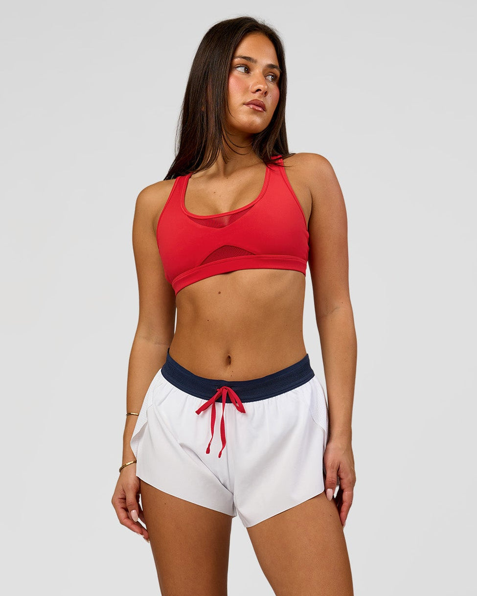 Woman wearing Accelerate 3" Mid-Rise Running Short - White-Future Navy | Model:Bianca | Size:S - view 1