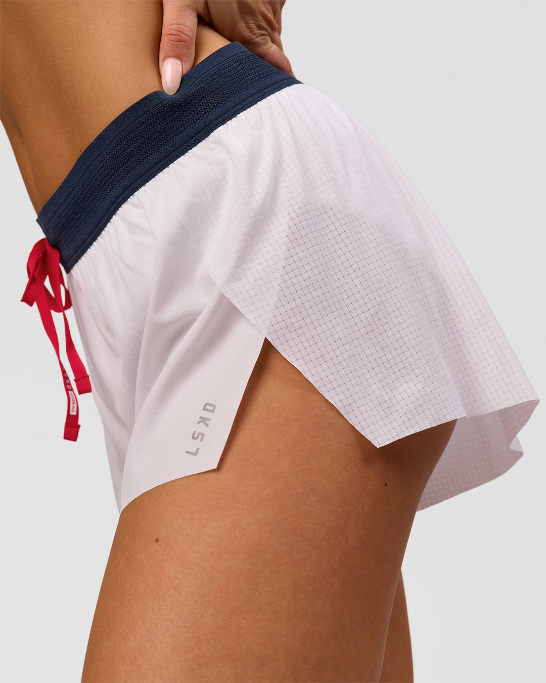 Woman wearing Accelerate 3" Mid-Rise Running Short - White-Future Navy | Model:Bianca | Size:S - view 8