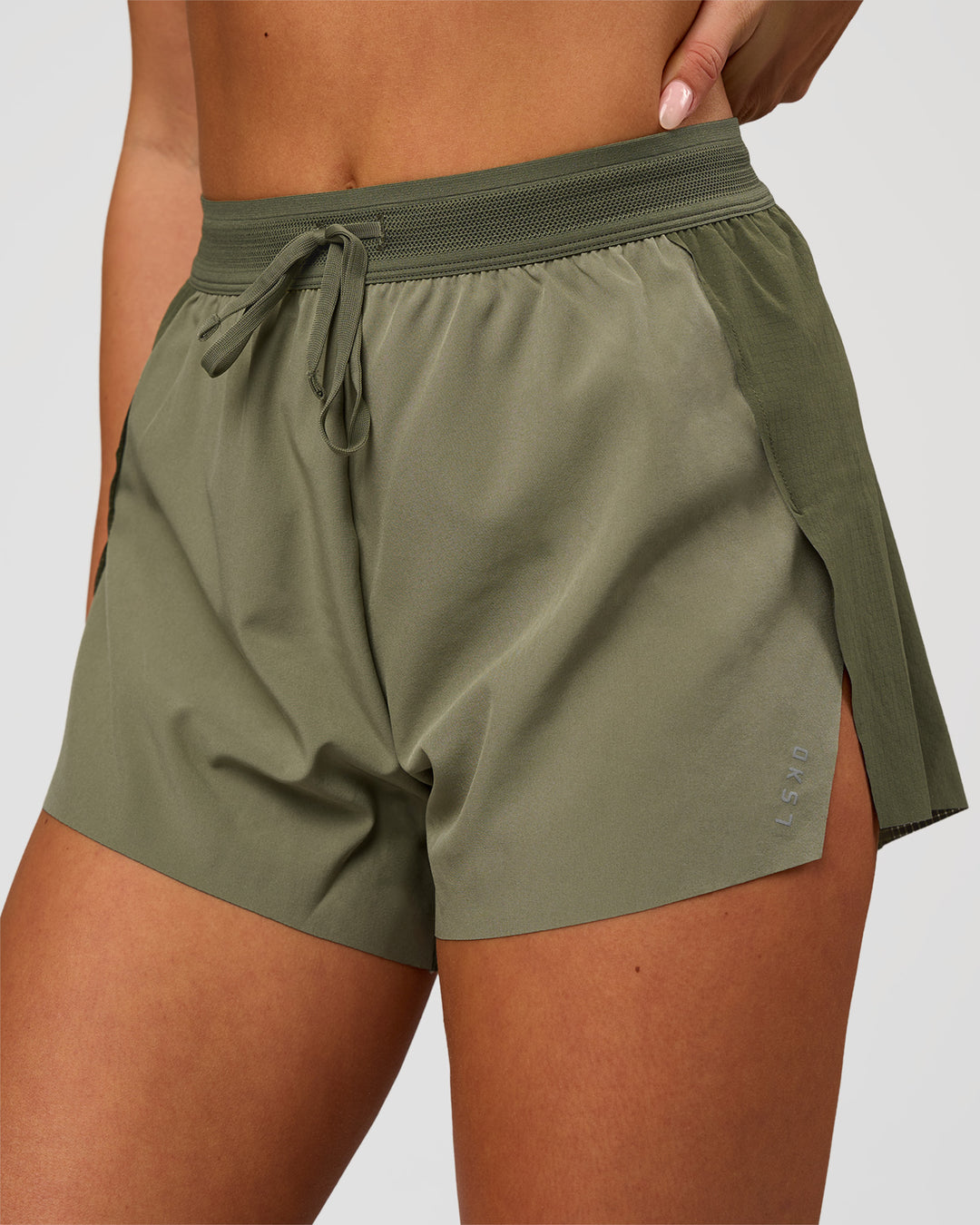 Woman wearing Accelerate 3" High-Rise Running Short - Pure Olive-Fog | Model:Bianca | Size:S - view 1