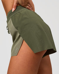 Woman wearing Accelerate 3" High-Rise Running Short - Pure Olive-Fog | Model:Bianca | Size:S | Thumbnail Index: 1