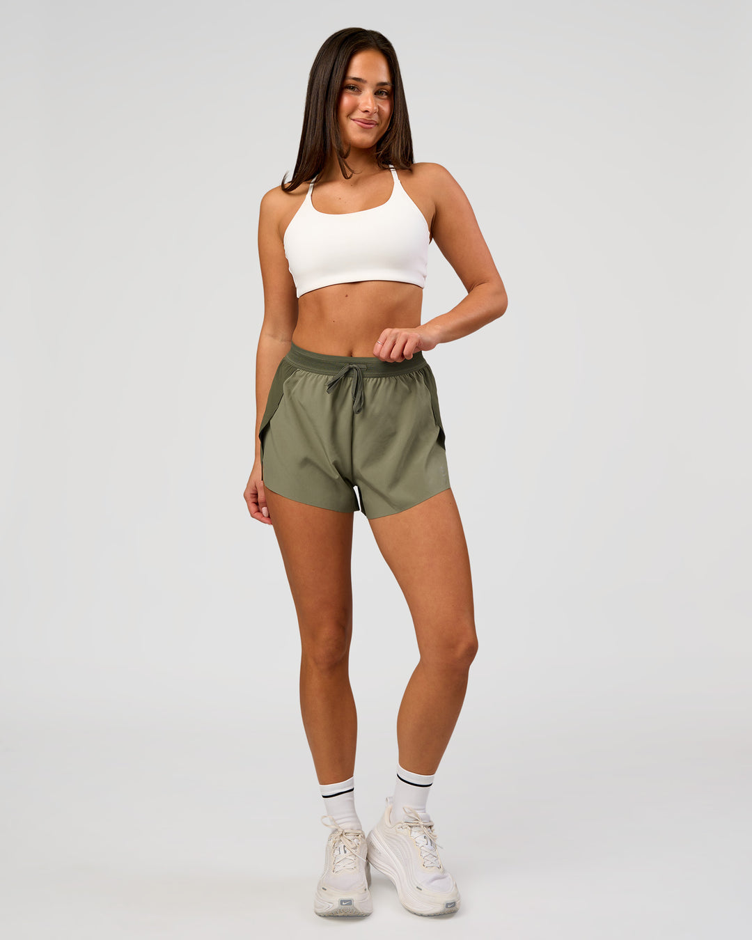 Woman wearing Accelerate 3" High-Rise Running Short - Pure Olive-Fog | Model:Bianca | Size:S - view 3
