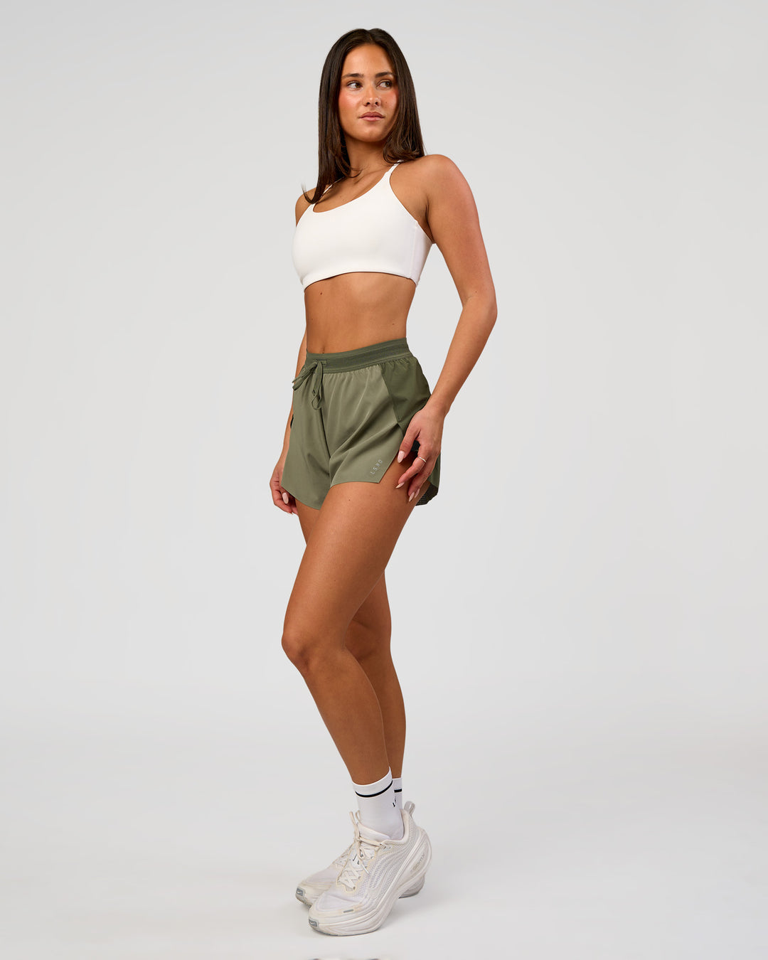 Woman wearing Accelerate 3" High-Rise Running Short - Pure Olive-Fog | Model:Bianca | Size:S - view 5