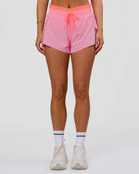 Woman wearing Accelerate Synergy 3" Running Short Short - Pink Rose-Hyper Orange | Model:Bianca | Size:S | Thumbnail Index: 12