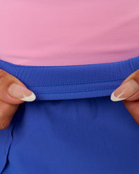 Woman wearing Accelerate Synergy 3" Running Short Short - Power Cobalt-Pink Rose | Model:Bianca | Size:S | Thumbnail Index: 14