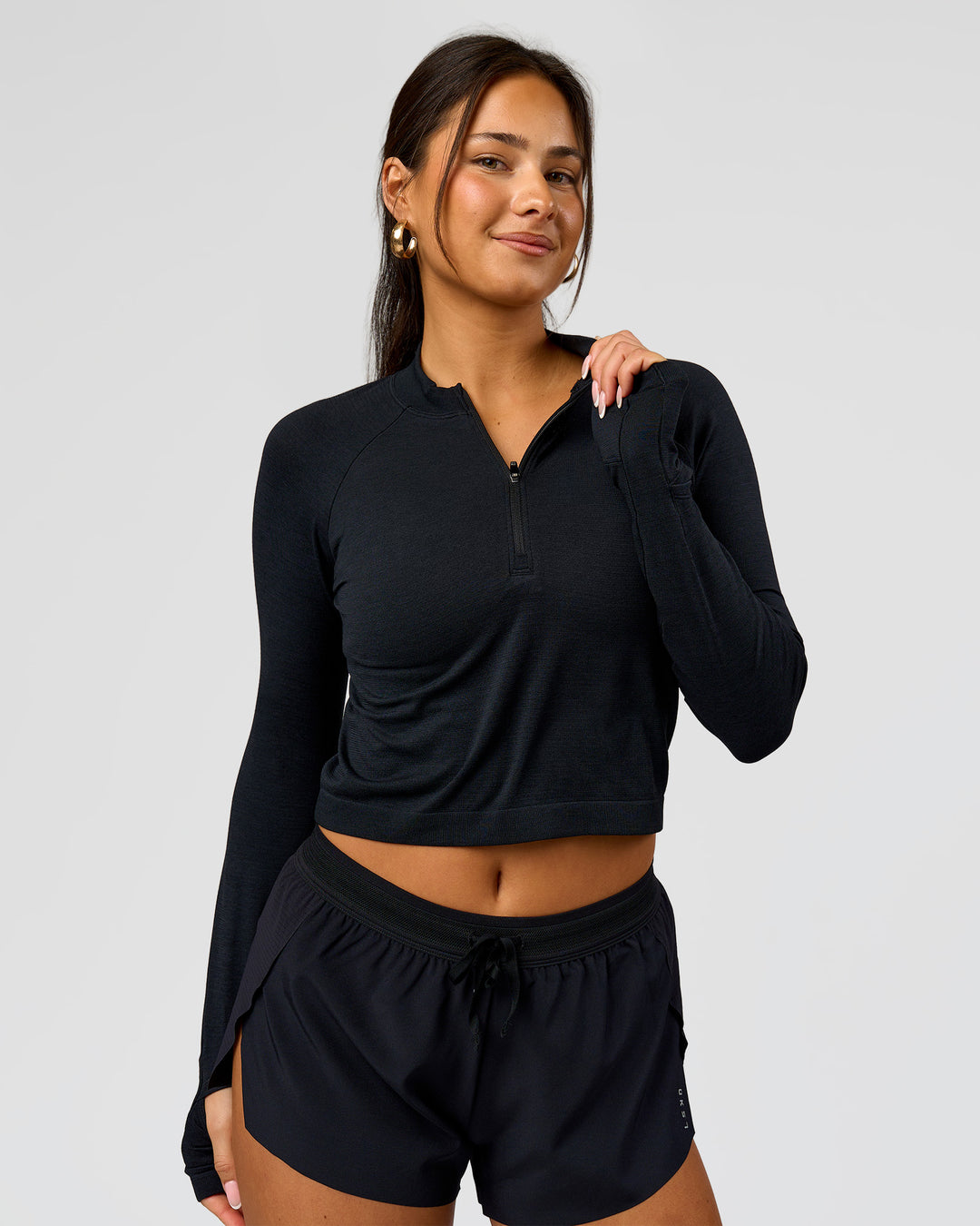 Woman wearing AeroFLX+ Long Sleeve Skimmer Half Zip - Black Marl | Model:Bianca | Size:S - view 11