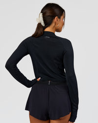 Woman wearing AeroFLX+ Long Sleeve Skimmer Half Zip - Black Marl | Model:Bianca | Size:S | Thumbnail Index: 3