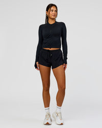 Woman wearing AeroFLX+ Long Sleeve Skimmer Half Zip - Black Marl | Model:Bianca | Size:S | Thumbnail Index: 7