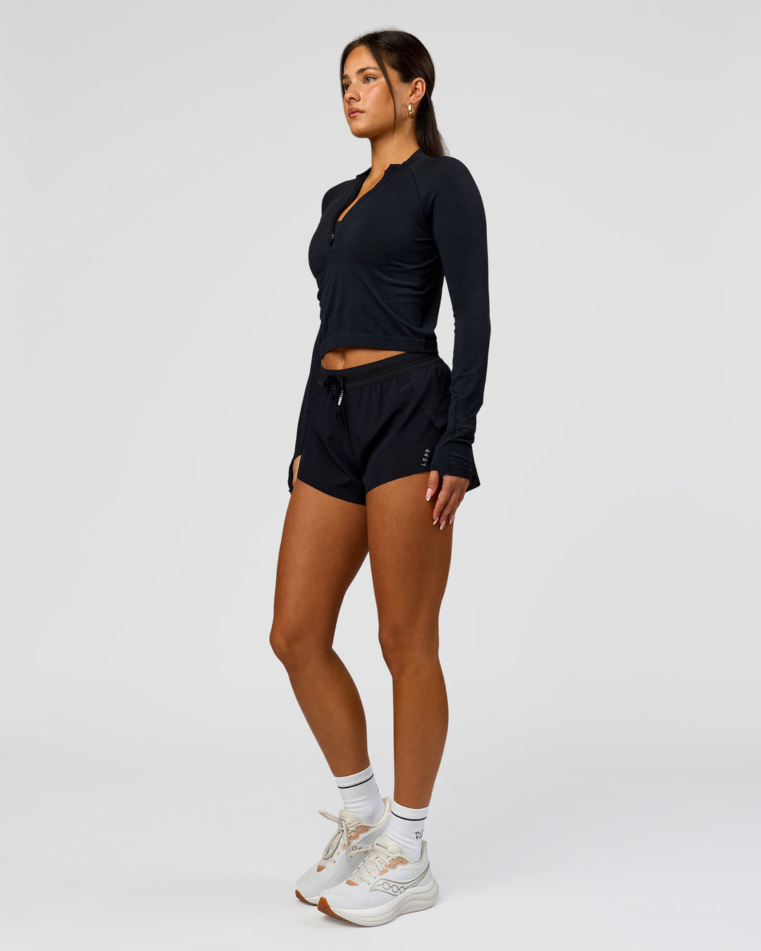 Woman wearing AeroFLX+ Long Sleeve Skimmer Half Zip - Black Marl | Model:Bianca | Size:S - view 10