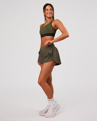 Woman wearing Distinction Sports Bra 2.0 - Pure Olive-Black | Model:Bianca | Size:S | Thumbnail Index: 4