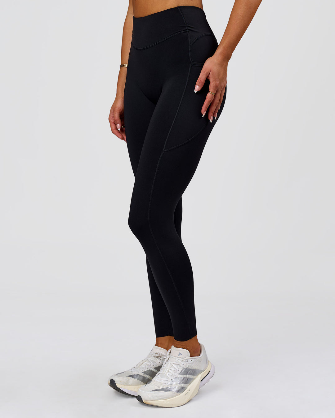 Woman wearing Elite Run High-Rise Full Length Legging Pockets - Black | Model:Bianca | Size:S - view 1