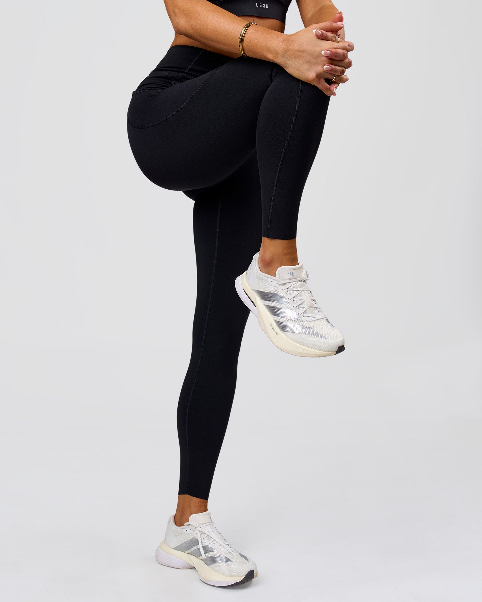 Woman wearing Elite Run High-Rise Full Length Legging Pockets - Black | Model:Bianca | Size:S