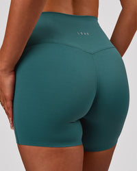 Woman wearing Elixir High-Rise 6” Short - Transformative Teal | Model:Bianca | Size:S | Thumbnail Index: 1