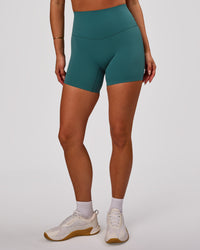 Woman wearing Elixir High-Rise 6” Short - Transformative Teal | Model:Bianca | Size:S | Thumbnail Index: 5